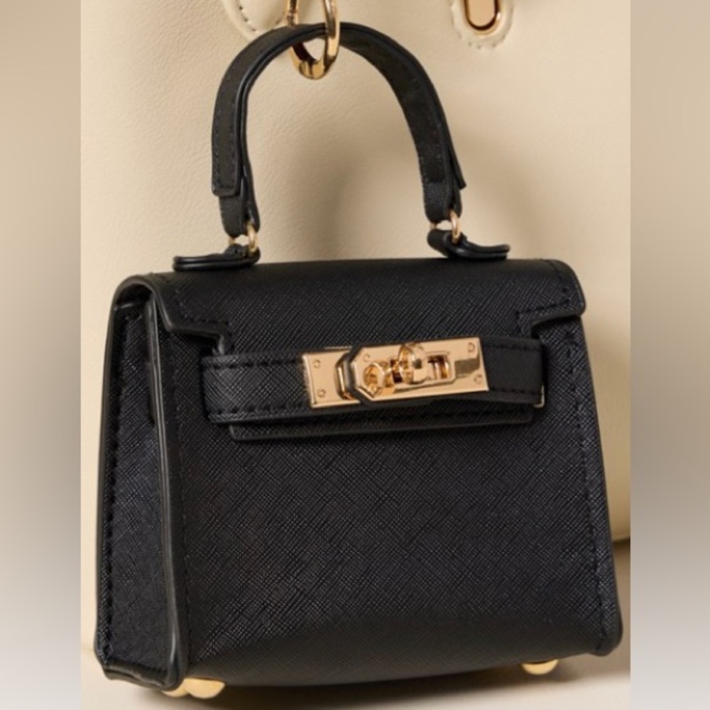 Francesca’s collections Mini Alice Bag Charm black turn lock bag